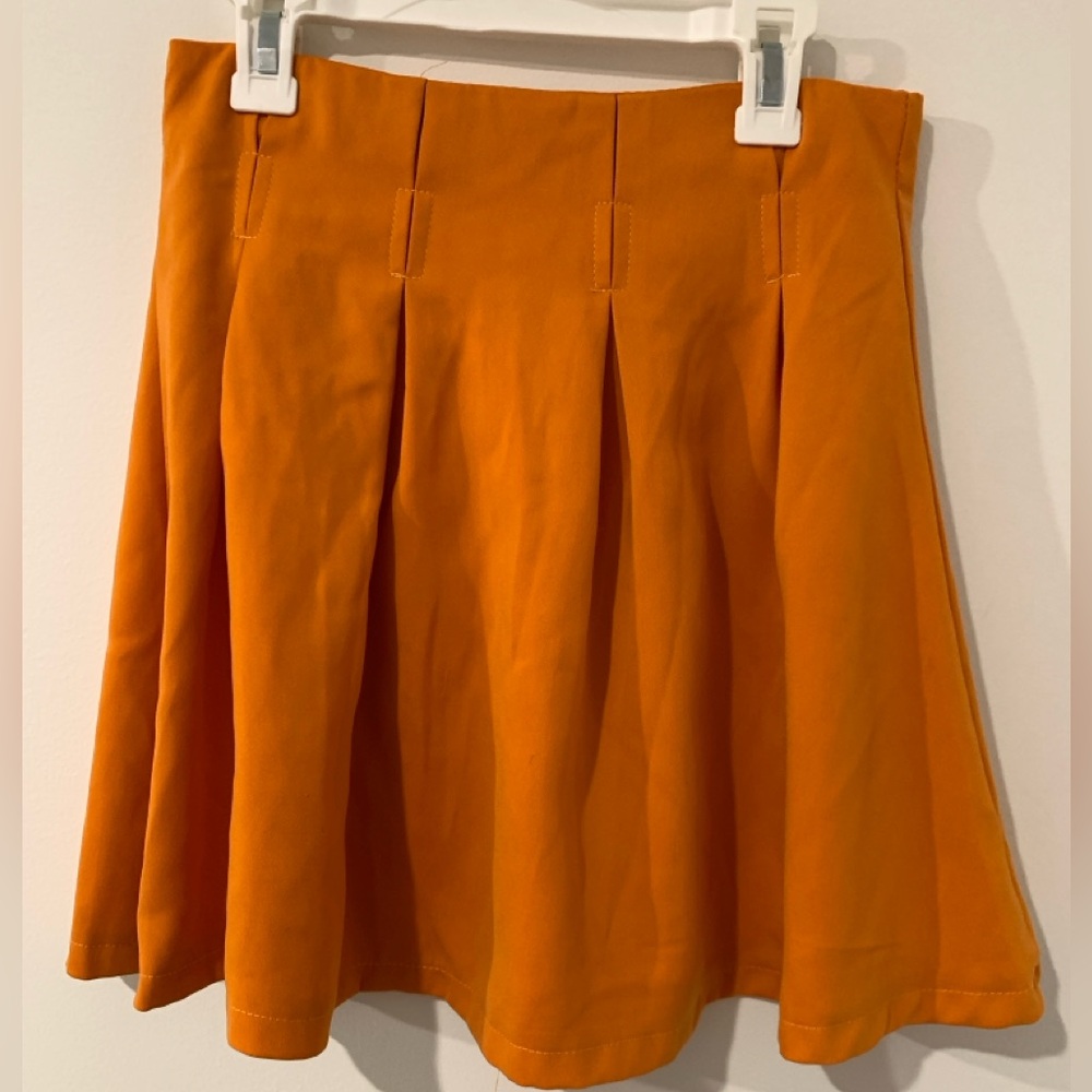 Orange pleated skirt